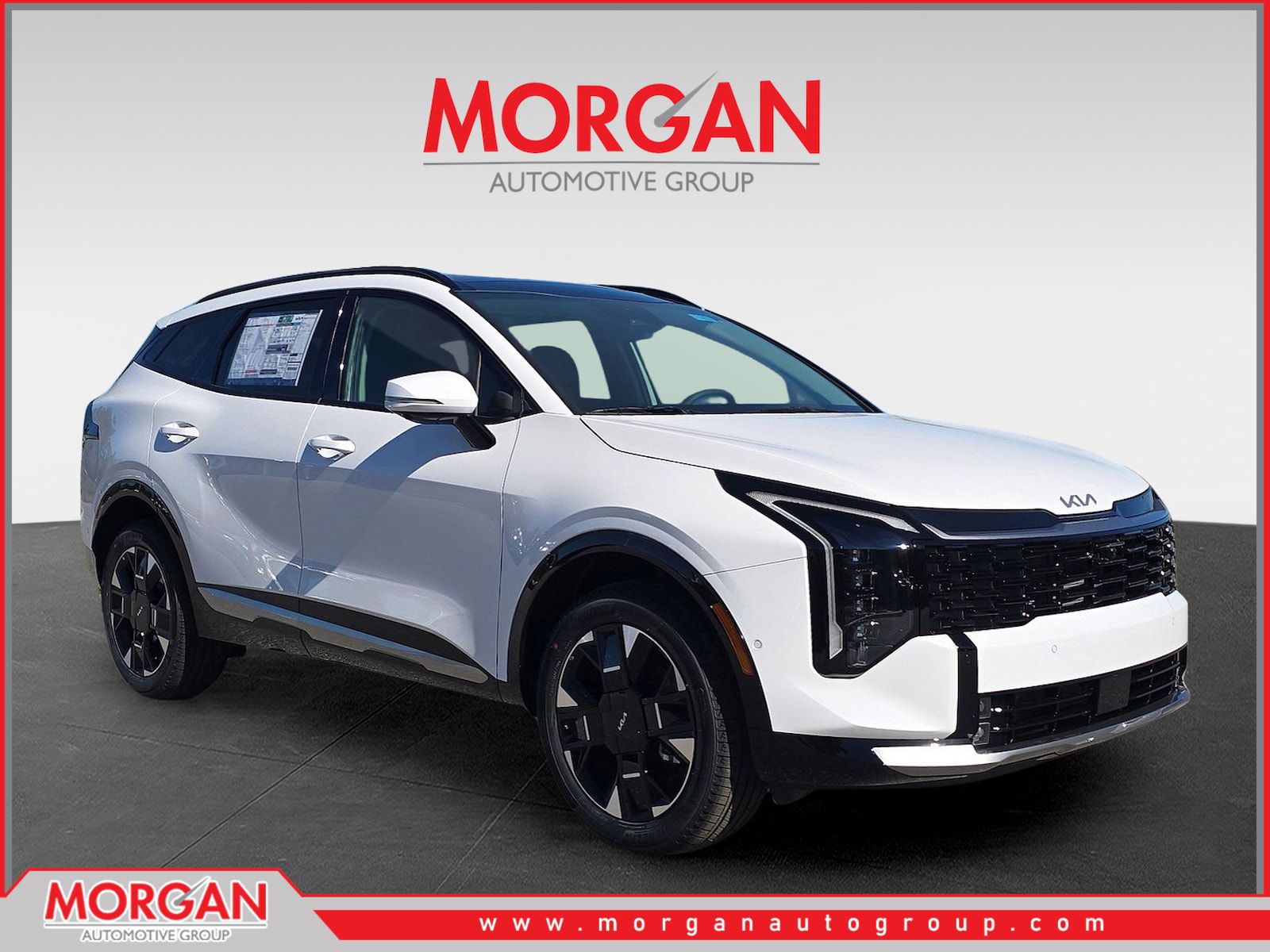 2026 Kia Sportage SX-Prestige in Glacial White Pearl — front three-quarter view