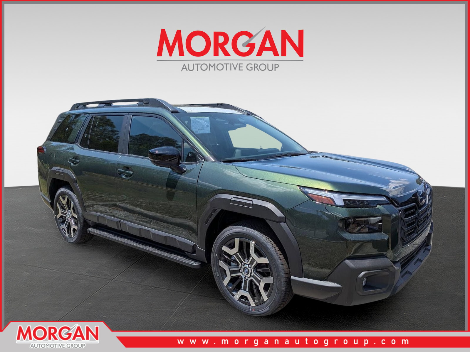2026 Subaru Outback Touring XT in Deep Emerald Green Pearl — front three-quarter view