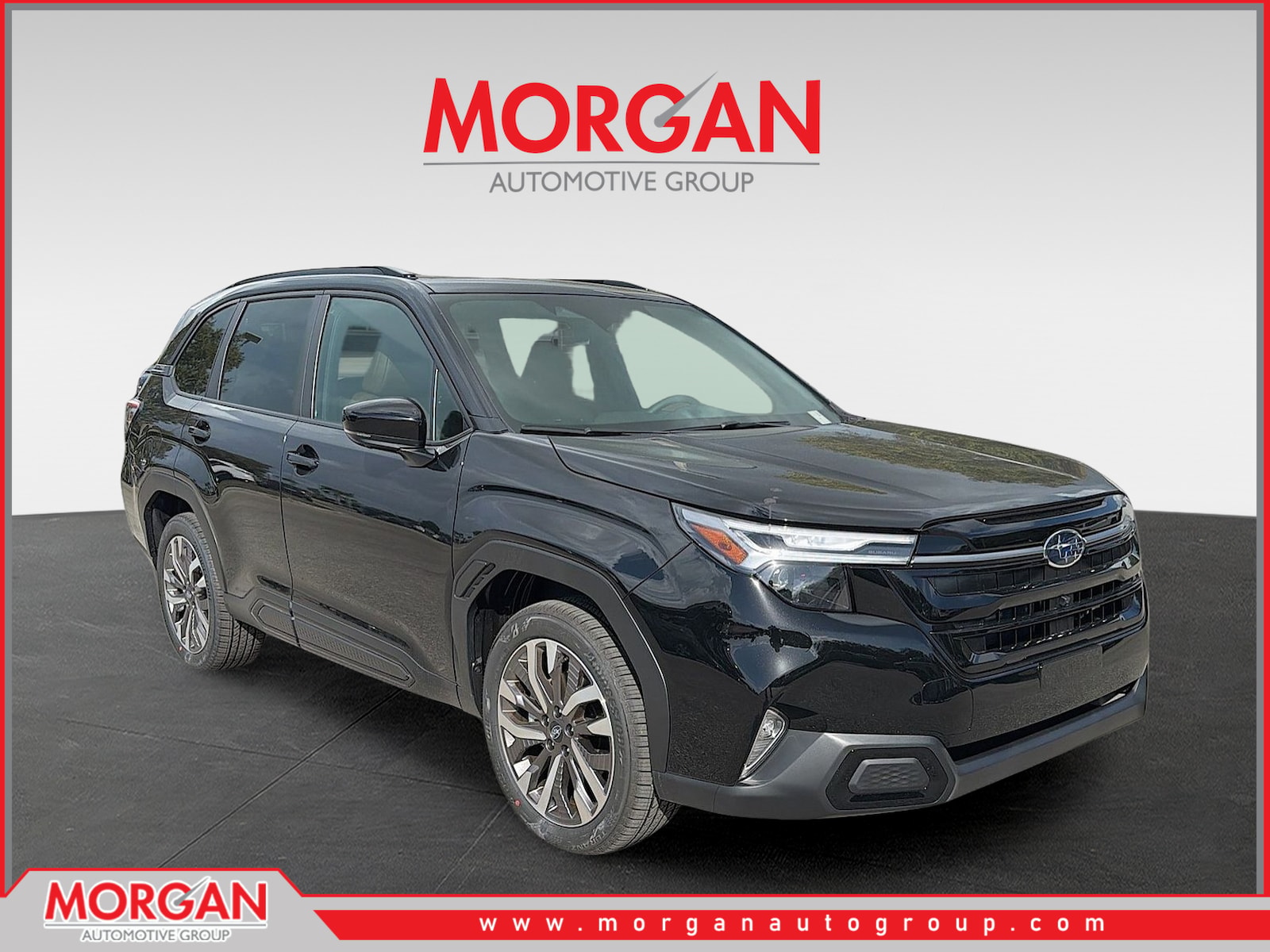 2026 Subaru Forester Touring in Crystal Black Silica — front three-quarter view