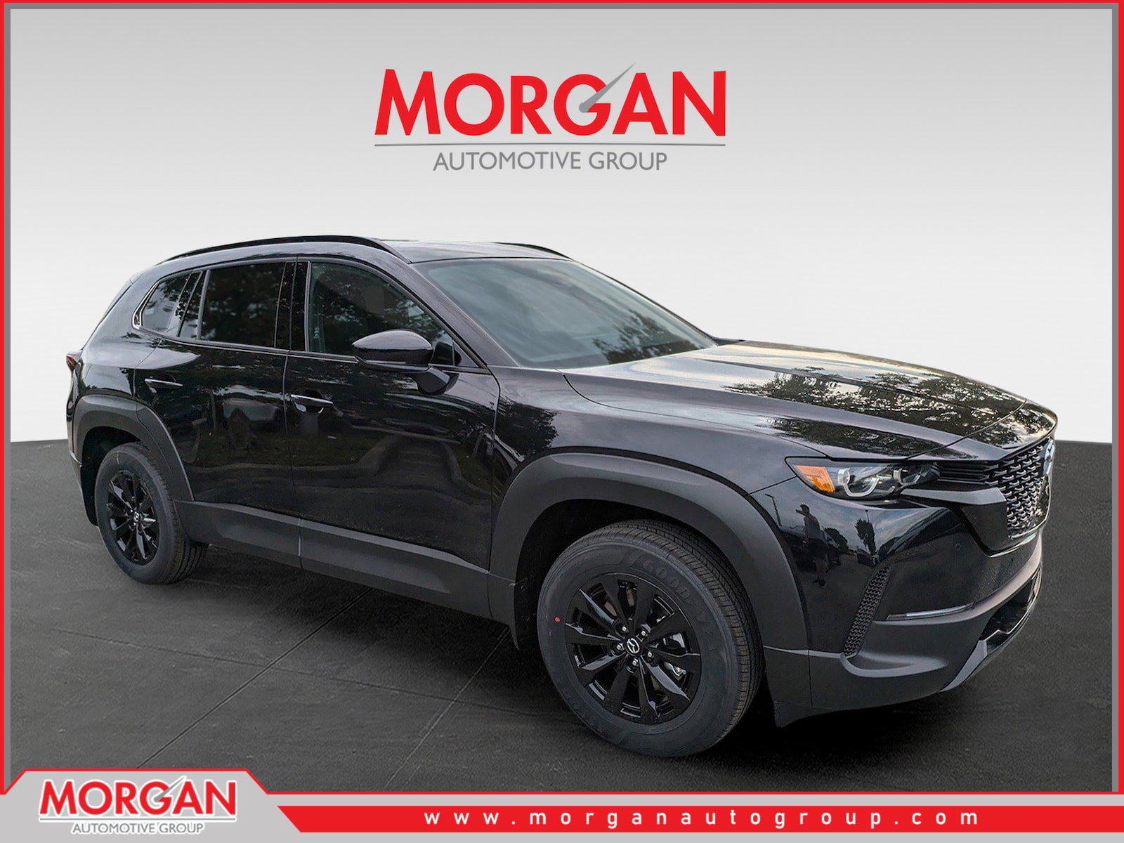 2026 Mazda CX-50 Hybrid Premium in Jet Black Mica — front three-quarter view