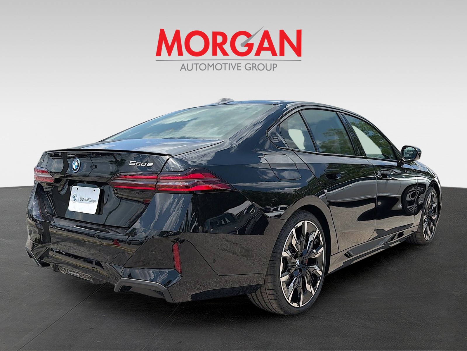 New 2027 Black Sapphire Metallic BMW 550e xDrive image 3