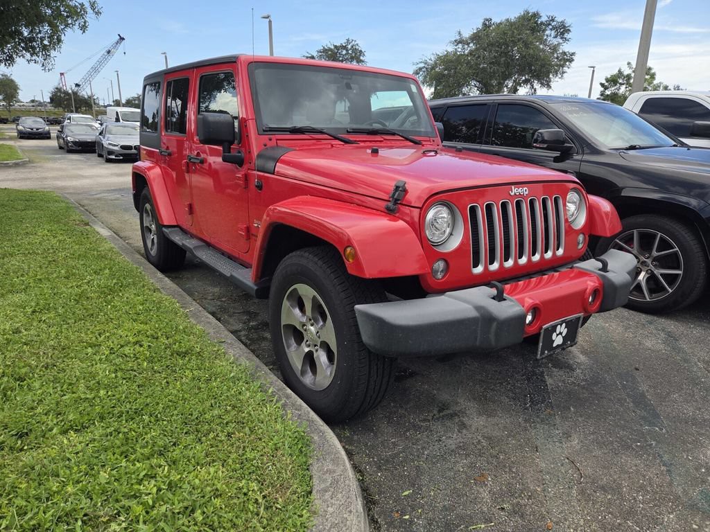 Used 2018 Red Jeep Unlimited Sahara image 2