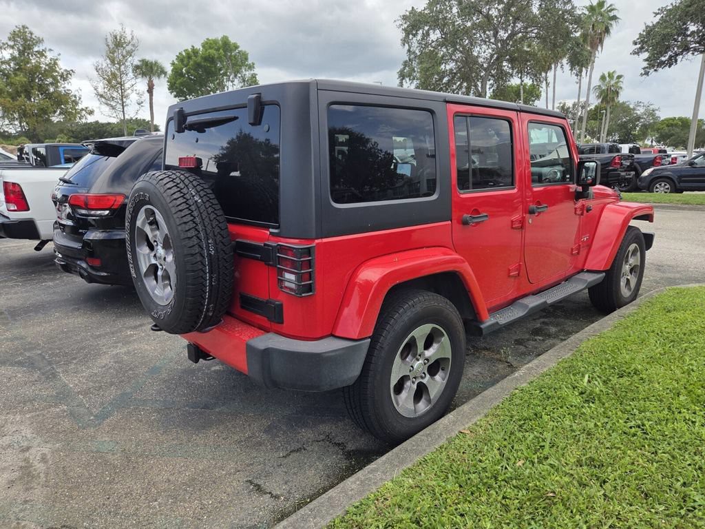Used 2018 Red Jeep Unlimited Sahara image 5