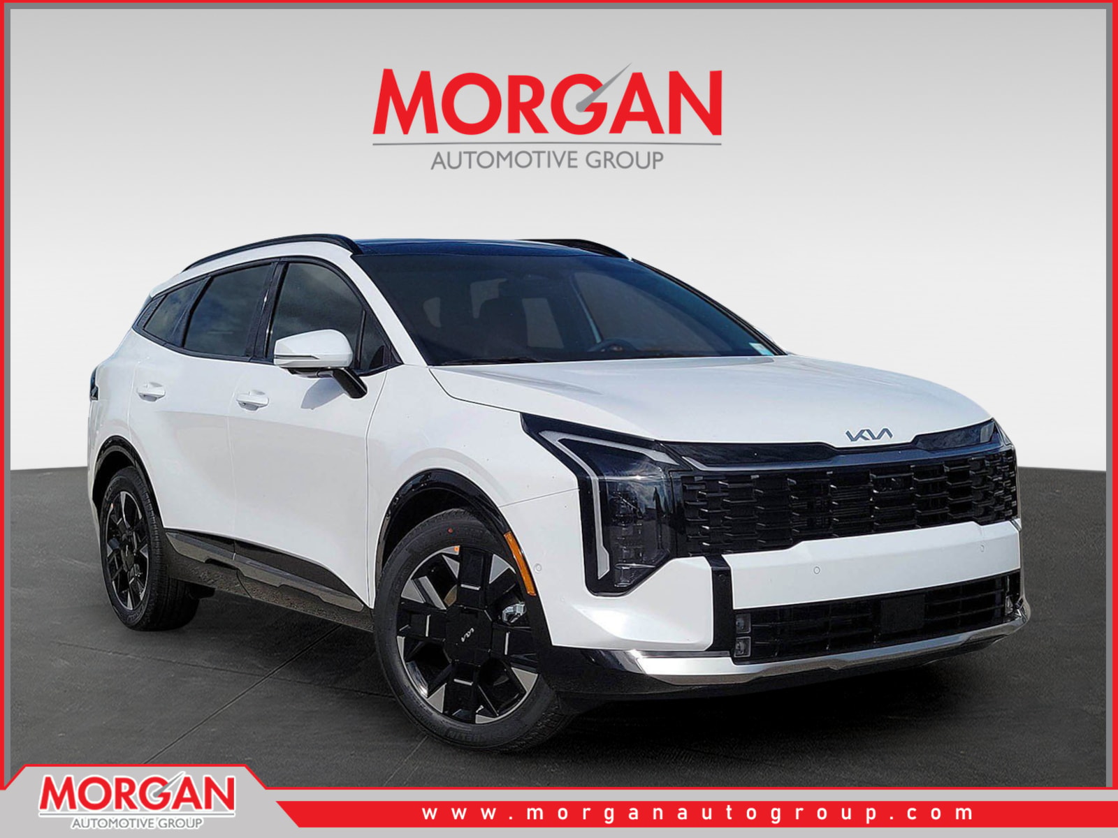 2026 Kia Sportage SX-Prestige in Glacial White Pearl — front three-quarter view