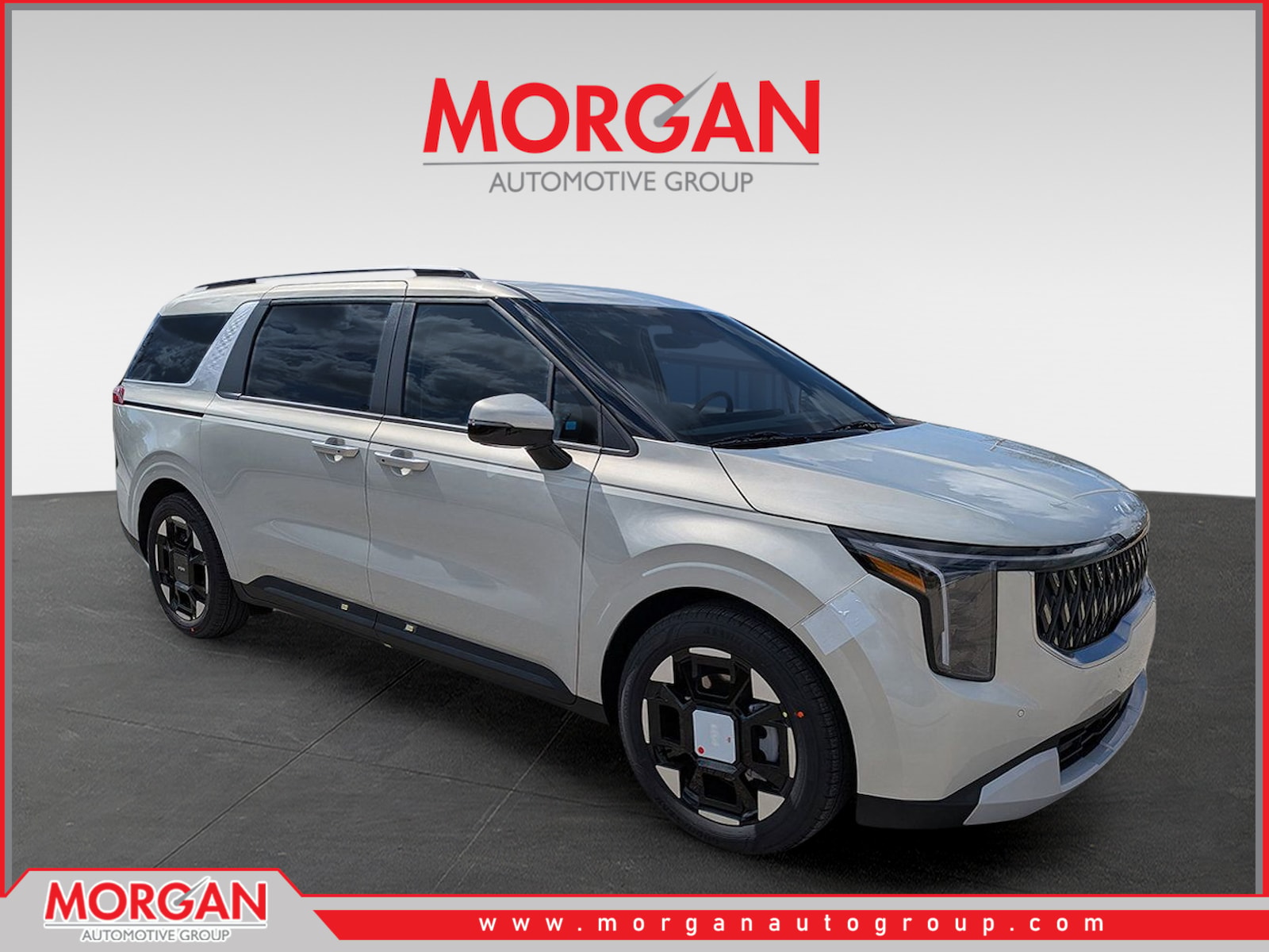 2026 Kia Carnival EX in Ivory Silver — front three-quarter view