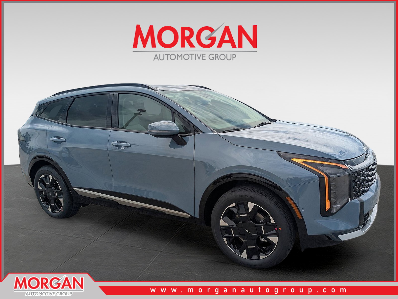 2026 Kia Sportage Hybrid SX-Prestige in Heritage Blue — front three-quarter view