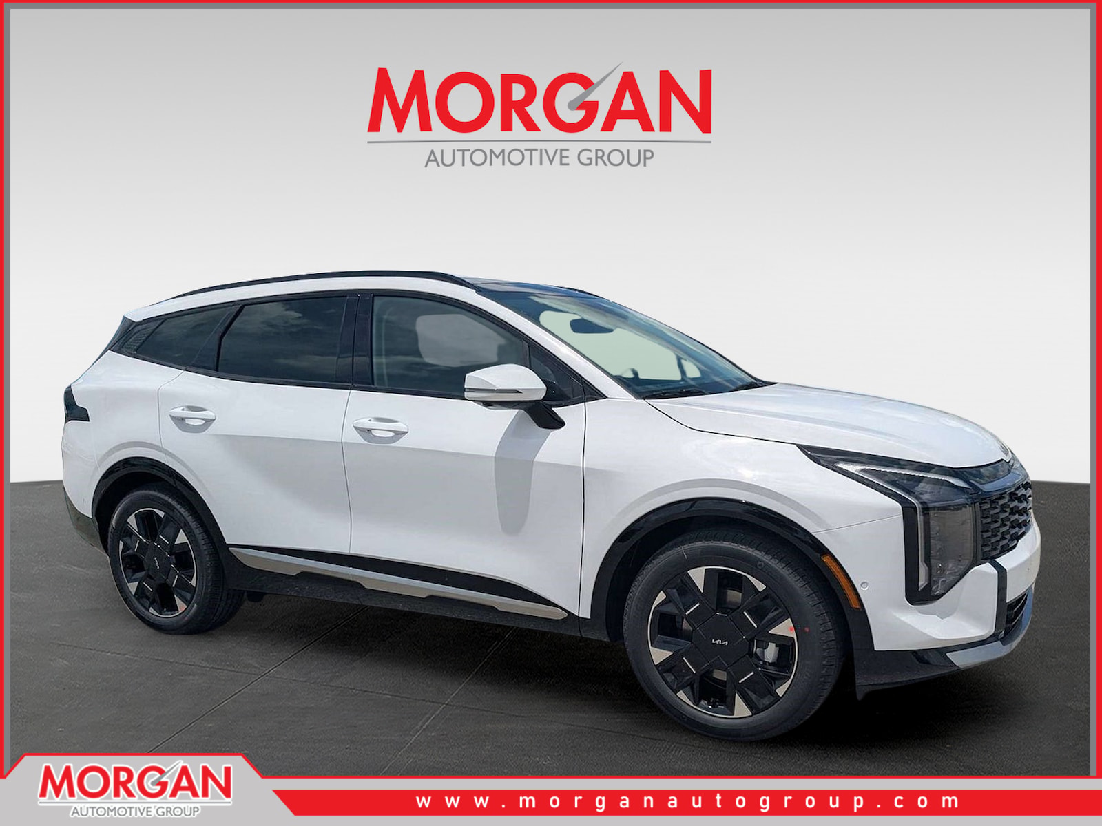 2026 Kia Sportage SX-Prestige in Glacial White Pearl — front three-quarter view