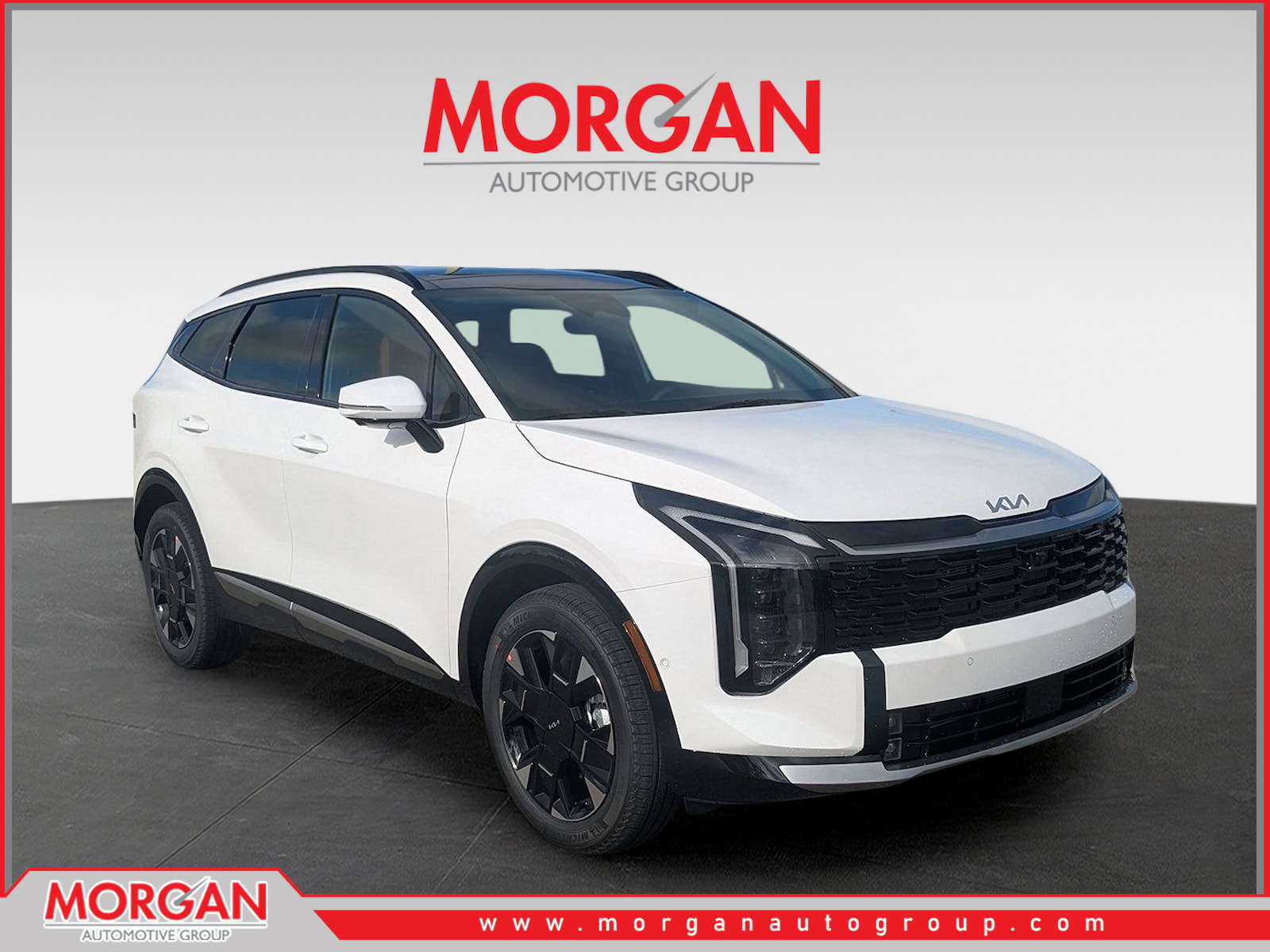 2026 Kia Sportage SX-Prestige in Glacial White Pearl — front three-quarter view