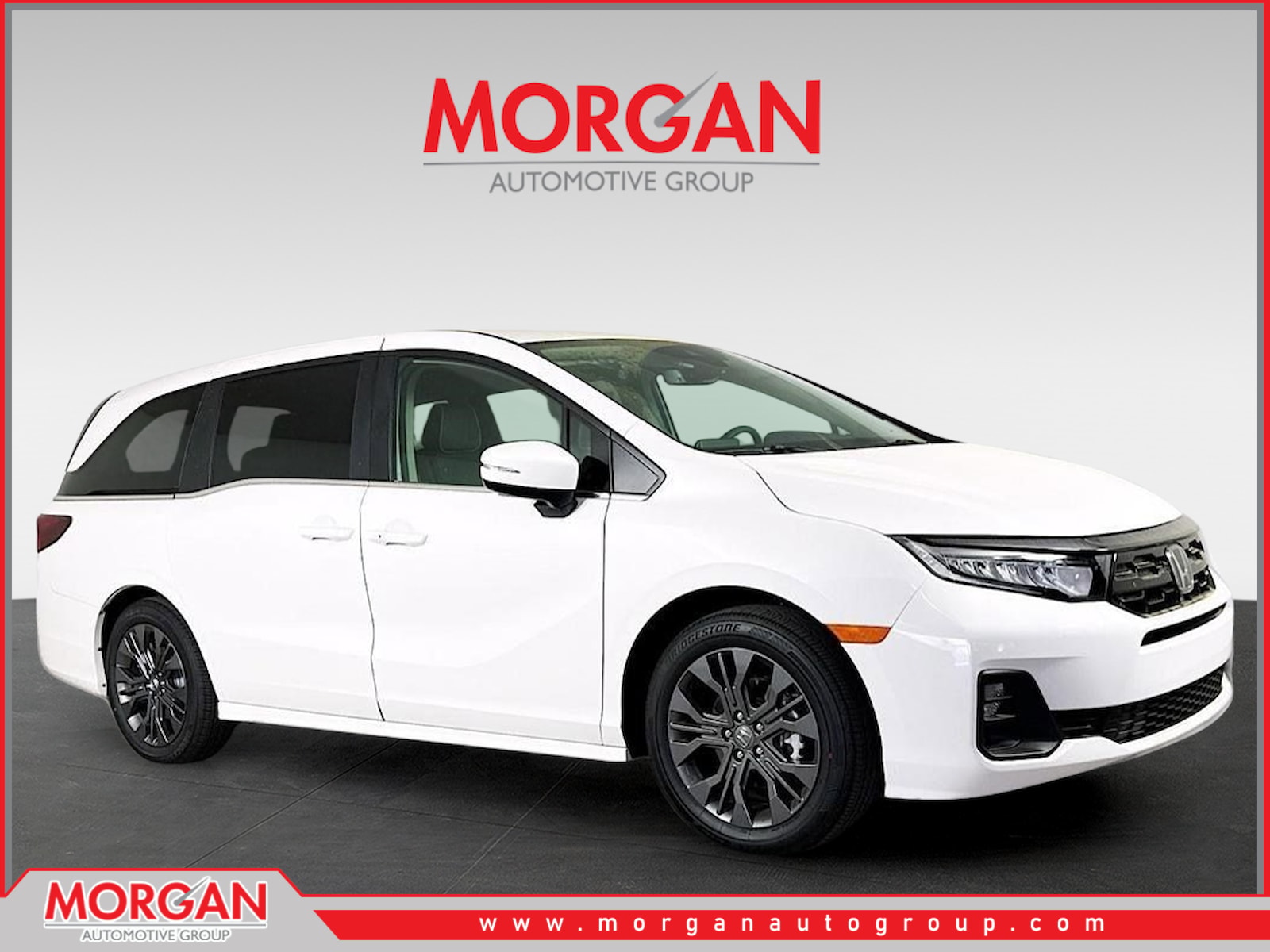 2026 Honda Odyssey Touring in Platinum White Pearl — front three-quarter view